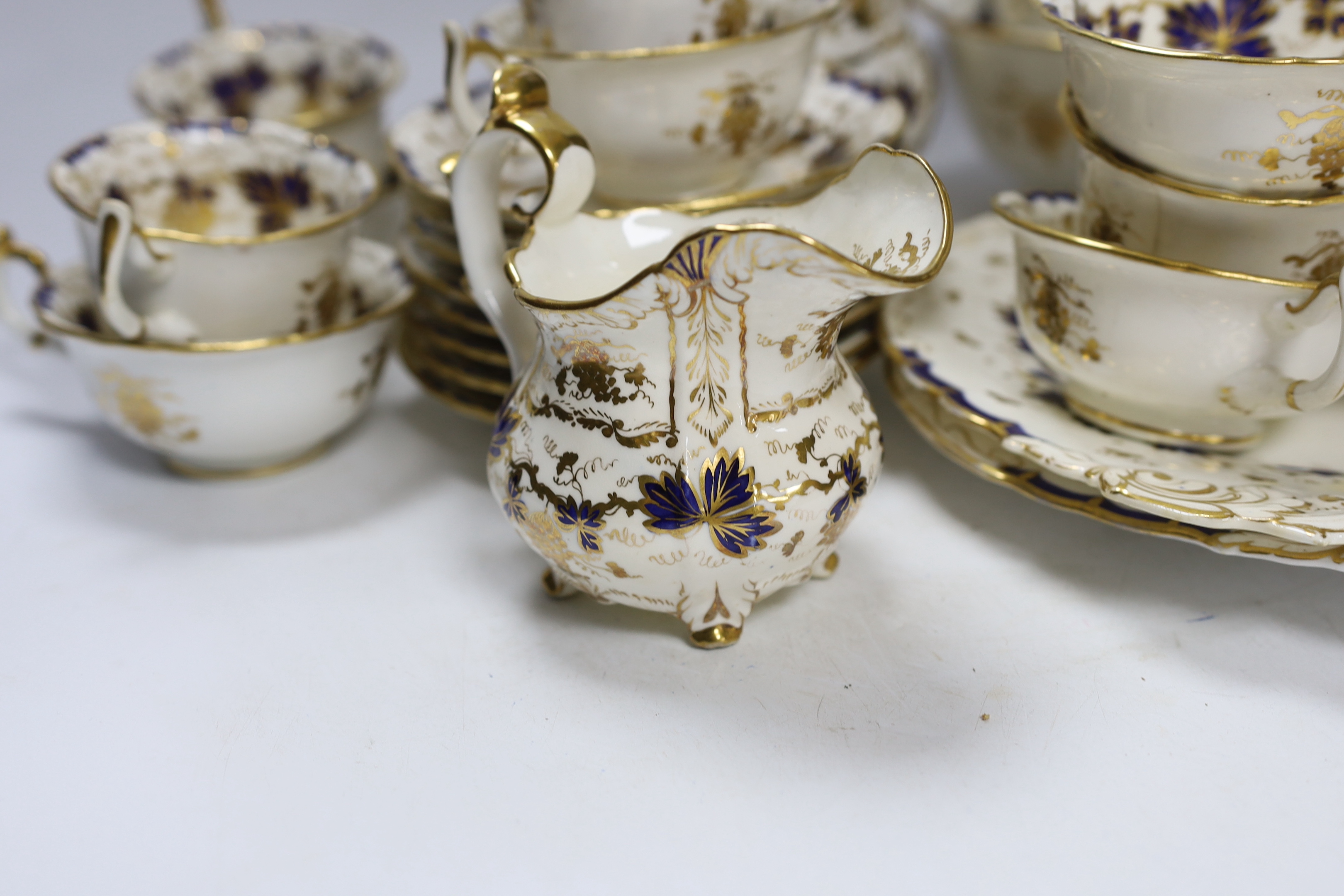 A mid 19th century Ridgeway style blue and gilt vine pattern twenty six piece part tea set